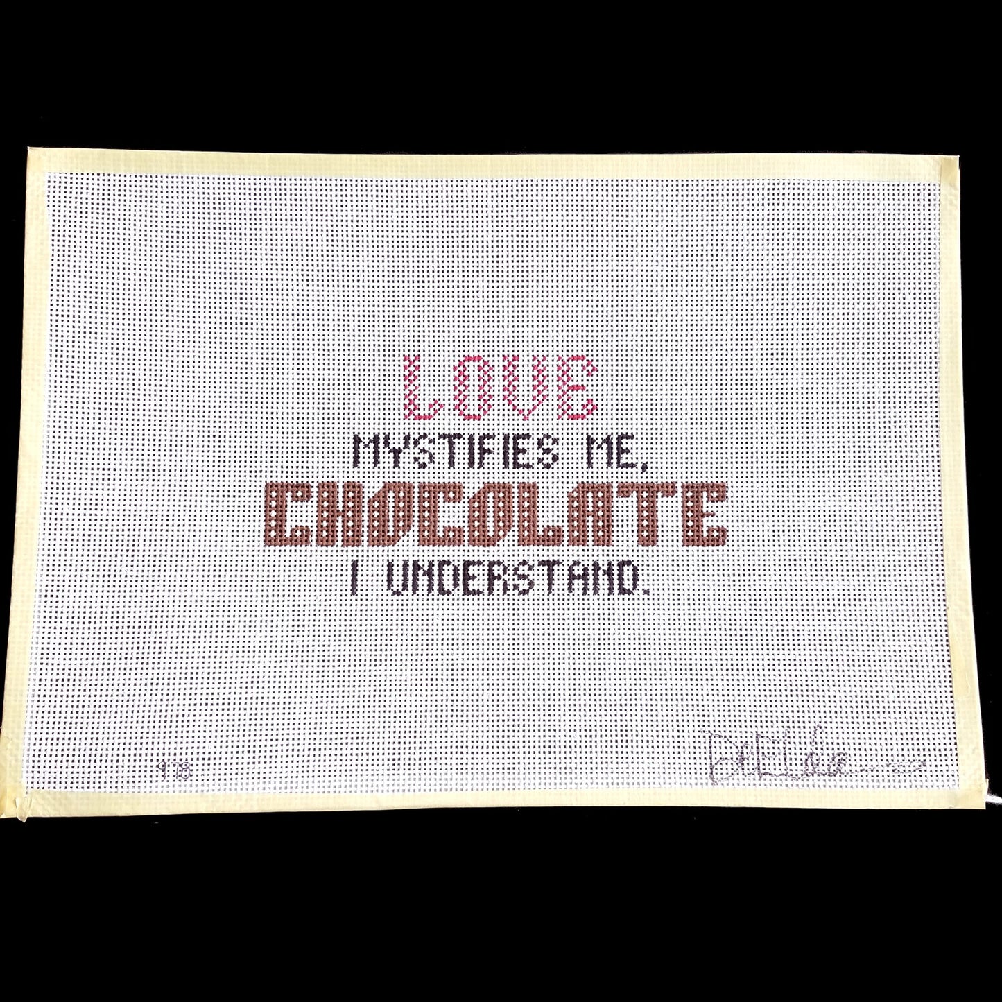 DeELDA NEEDLEPOINT CANVAS:  LOVE MYSTIFIES ME, CHOCOLATE I UNDERSTAND  BM1