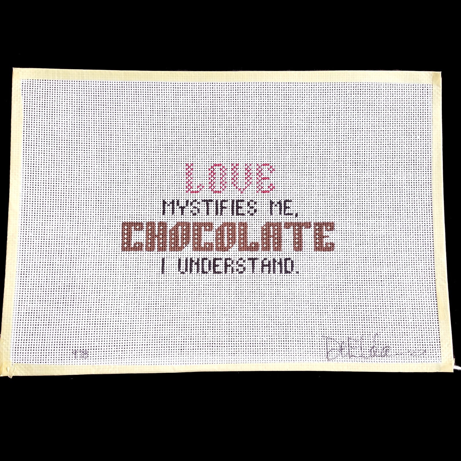 DeELDA NEEDLEPOINT CANVAS:  LOVE MYSTIFIES ME, CHOCOLATE I UNDERSTAND  BM1
