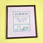 FRAMED COMPLETED CROSS STITCH:  BABY INFANT0