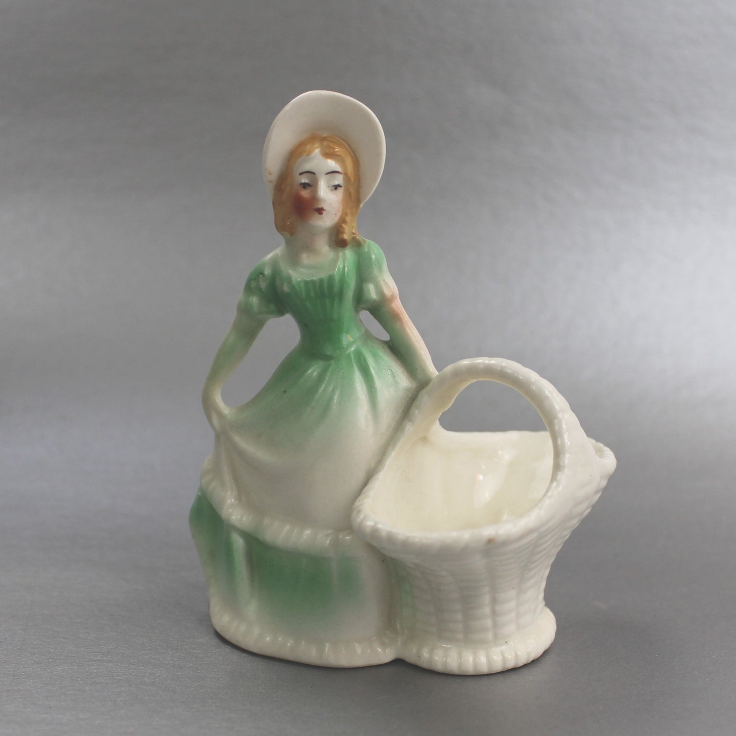 VINTAGE CZECHOSLAVAKIA WOMAN WITH BASKET FIGURINE      FM0