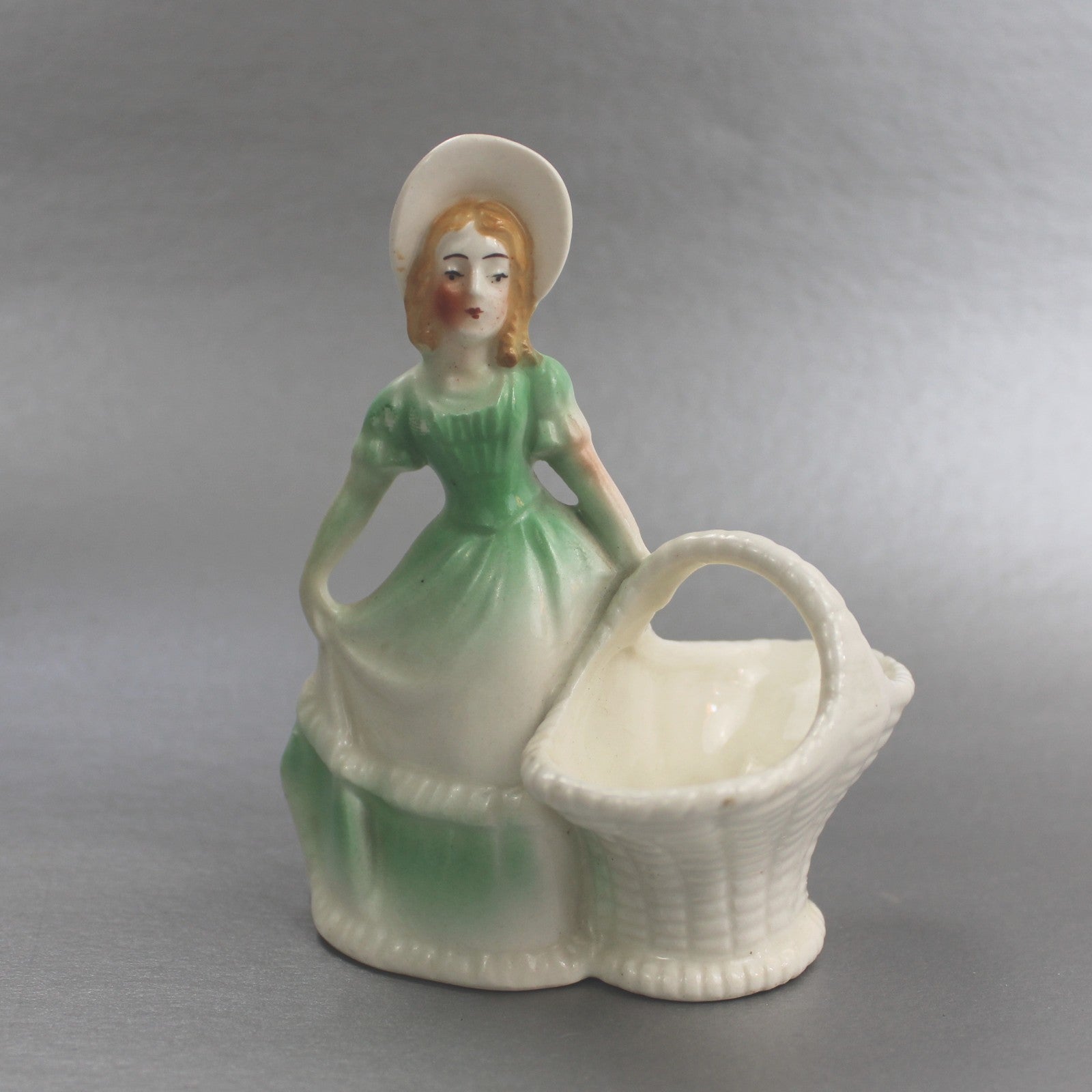 VINTAGE CZECHOSLAVAKIA WOMAN WITH BASKET FIGURINE      FM0